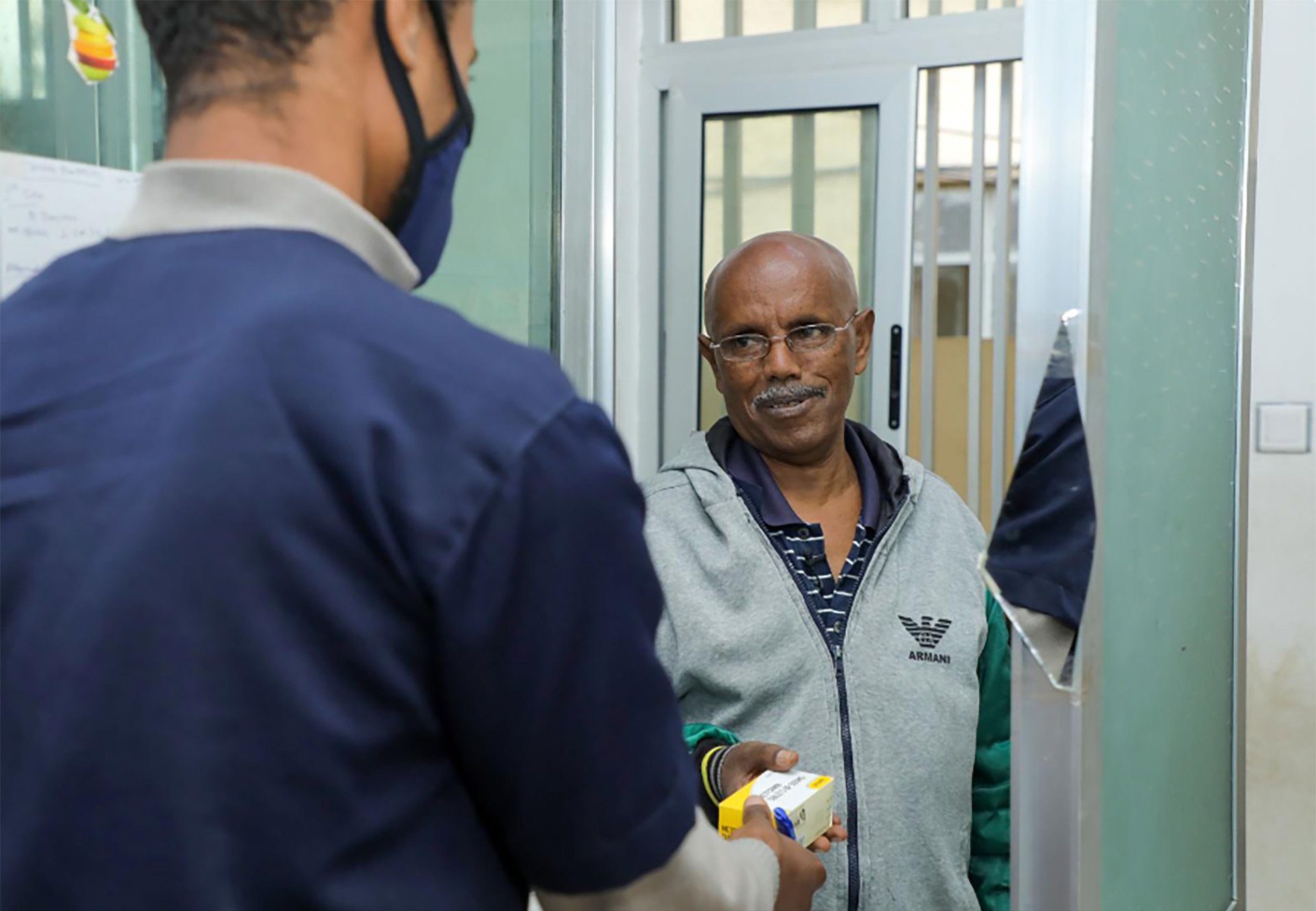 ethiopia-news-story A health worker handing a package to a person