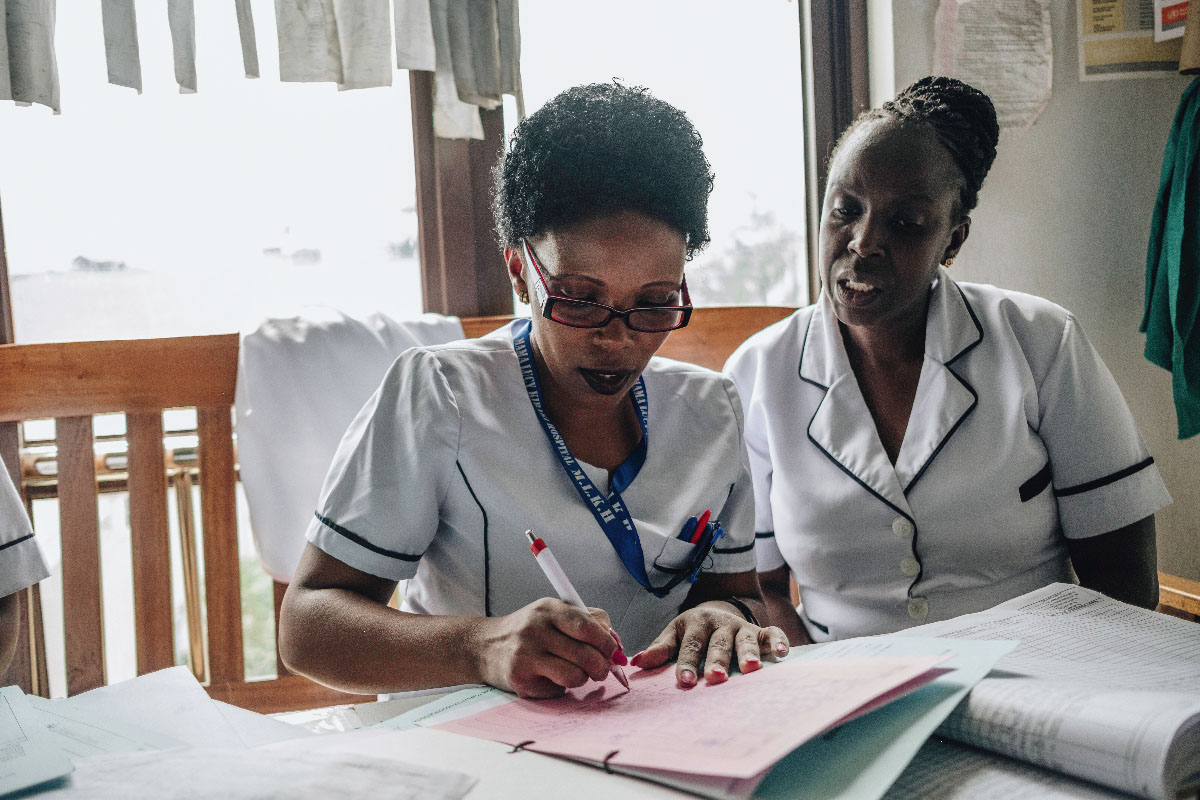 Two Kenyan nurses Two Kenyan nurses filling forms