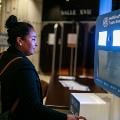 young woman in front of a selfie booth