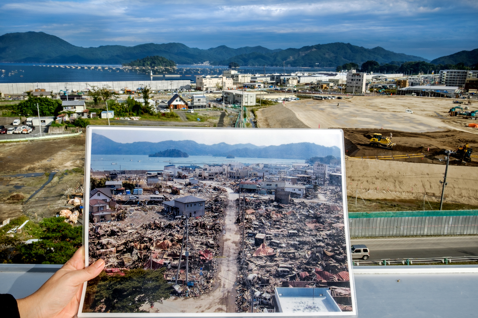 Miyako bay after the 9.0 magnitude earthquake hit the region in 2011 and how reconstruction progress.