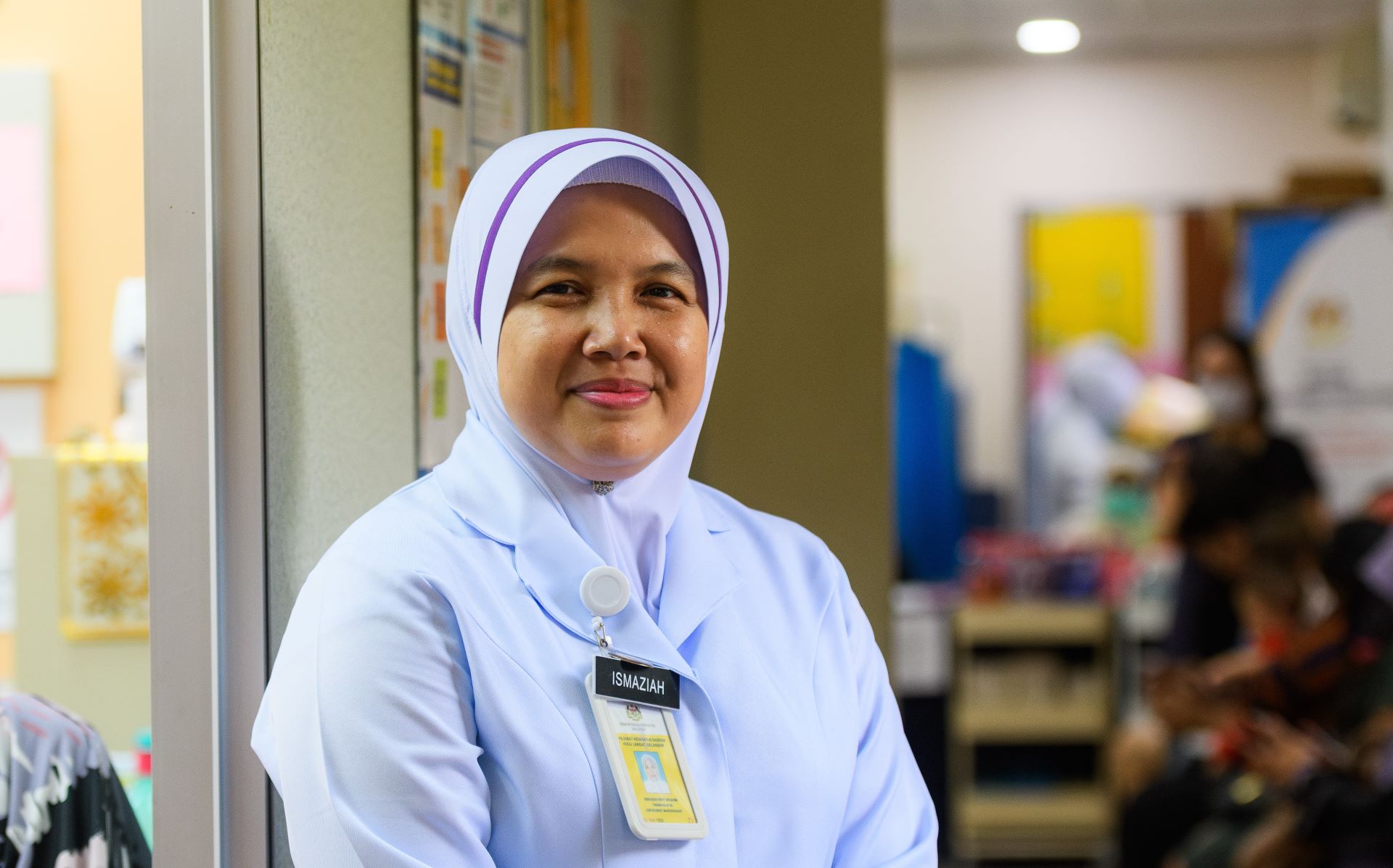Nurse in Malaysia A community nurse and midwife stands in a clinic