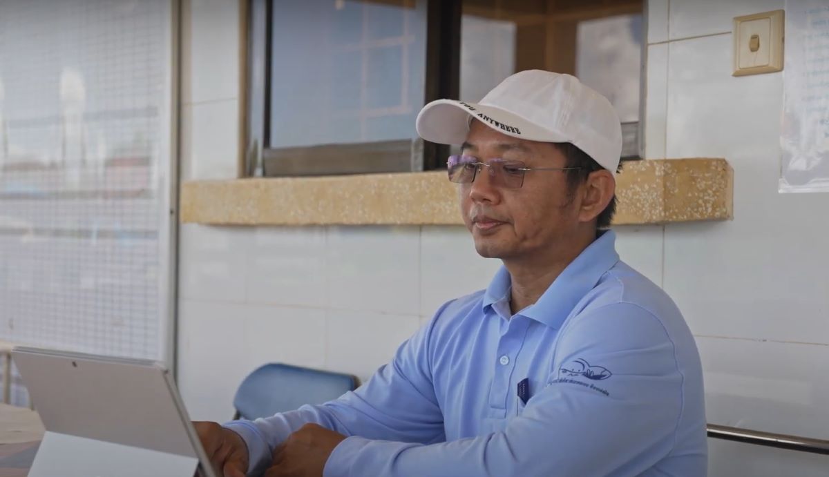 So Visal village A health worker stills in front of a tablet communicating with his patients